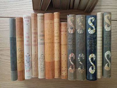 a lot of books that are sitting on a table