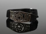 a close up of a bracelet with a cross on it