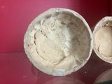two bowls that are sitting on a glass table