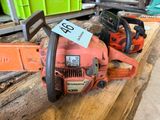 a chainsaw sitting on a table with a price tag on it