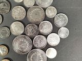 a lot of coins that are on the table