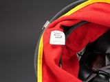 a red and black hat with a yellow trim