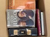 a box of books that are sitting on a table