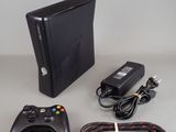 a video game console and a game controller on a table