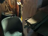 an image of a cluttered room with a chair and other items