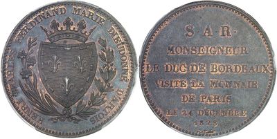 a close up of a coin with a crown on top of it