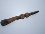 an old knife with a leather strap on it