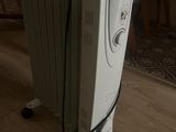 a white radiator sitting on the floor in a living room