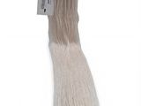 a close up of a long white hair with a tag on it
