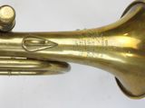 an image of a brass trumpet with a bell on a white background