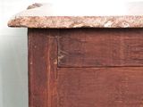 a brown wooden cabinet with a marble top