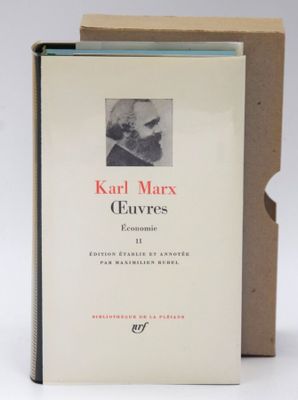 the book is in a cardboard box on a white surface