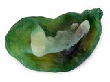 a green shell with a white object inside of it