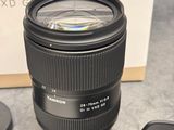 a camera lens sitting on top of a table next to a box