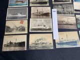 a lot of old postcards of ships on display