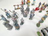 a lot of figurines that are sitting on a table