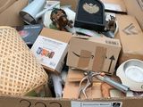 a cardboard box full of items that are in the street