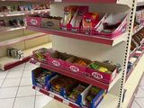 a lot of snacks on the shelves in the store