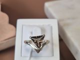 a ring that is sitting in a box on a table