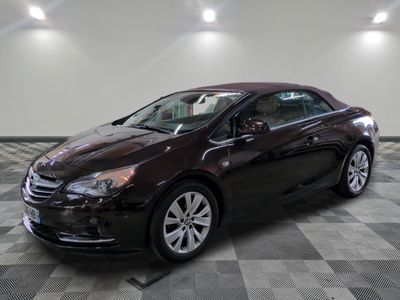 a picture of a brown car parked in a garage