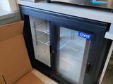 a coffee machine sitting next to a box on the floor