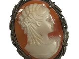 an image of a woman ' s profile is shown in a broochle
