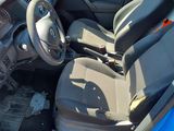 the interior of a car with a steering wheel and a dashboard