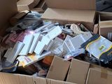 a cardboard box full of electronic devices and other items