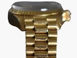 a gold watch with a black face on a white background
