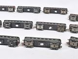 a lot of miniature trains that are sitting on a table