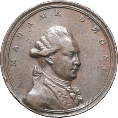 une vieille pièce de monnaie sur laquelle figure le portrait d'un homme