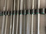 a lot of metal poles that are hanging on the wall