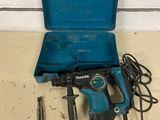 a blue tool box with a hammer, drill and other tools
