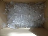 a box full of empty plastic bottles sitting on the floor