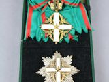 an image of a box containing a cross and a ribbon
