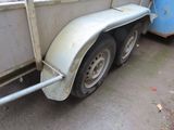 an image of a trailer with a flatbed trailer attached
