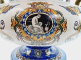 a vase with a picture of a man and a woman on it