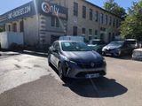 a car parked in front of a building with a sign on it