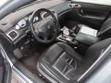 the interior of a car with black leather seats and a steering wheel