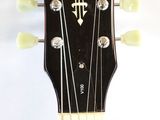 a close up of a guitar neck with the headstocks and frets