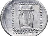 a close up of a silver coin with a harp on it