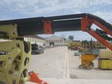 a crane that is sitting in the middle of a parking lot