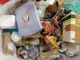 a pile of junk in a bin on the floor