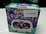 a box of fuppies on a table with a box of fuppies in the background