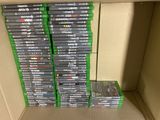 many dvds stacked on top of each other in a box