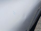 a close up of a car ' s hood with a sticker on it