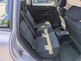 the back seats of a car are empty in a parking lot