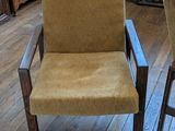 two chairs that are sitting on a wooden floor