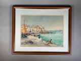 aquarelle encadrée représentant des bateaux sur la plage, devant des immeubles