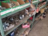 many boxes of tools on the shelves in the garage